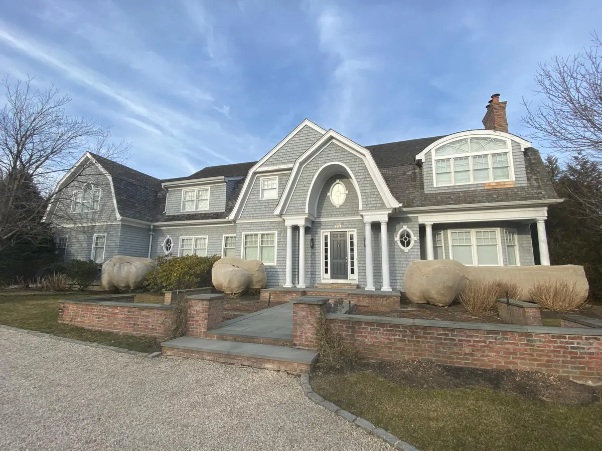Large gray shingle-style home exterior