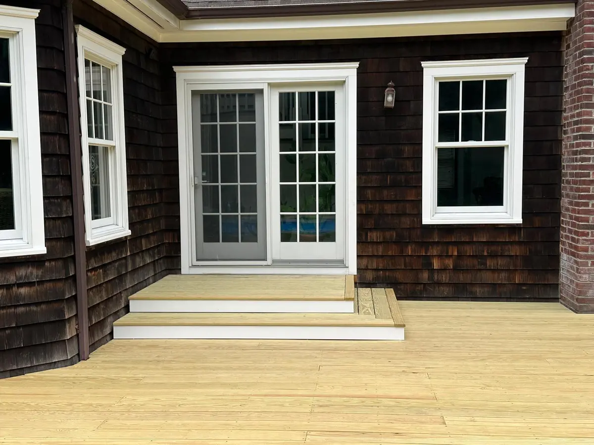 Finished deck steps leading to a home's entry