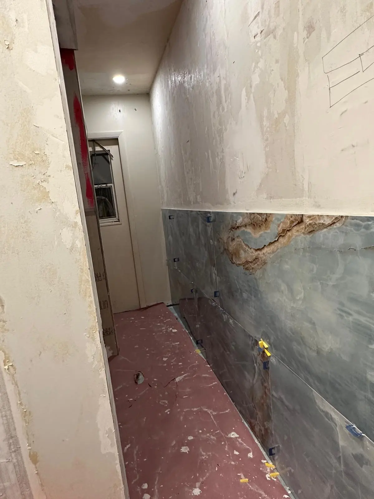 Water-damaged wall opened up for repair