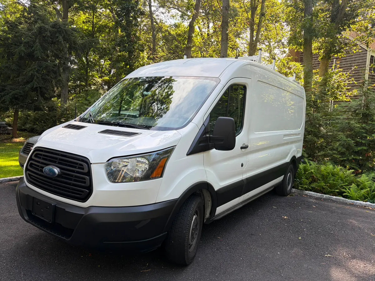 The Tovar's Painting van on a job site